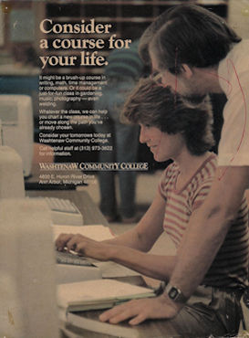 Laurence helping a computer student in a Washtenaw Community College pulblicity photo